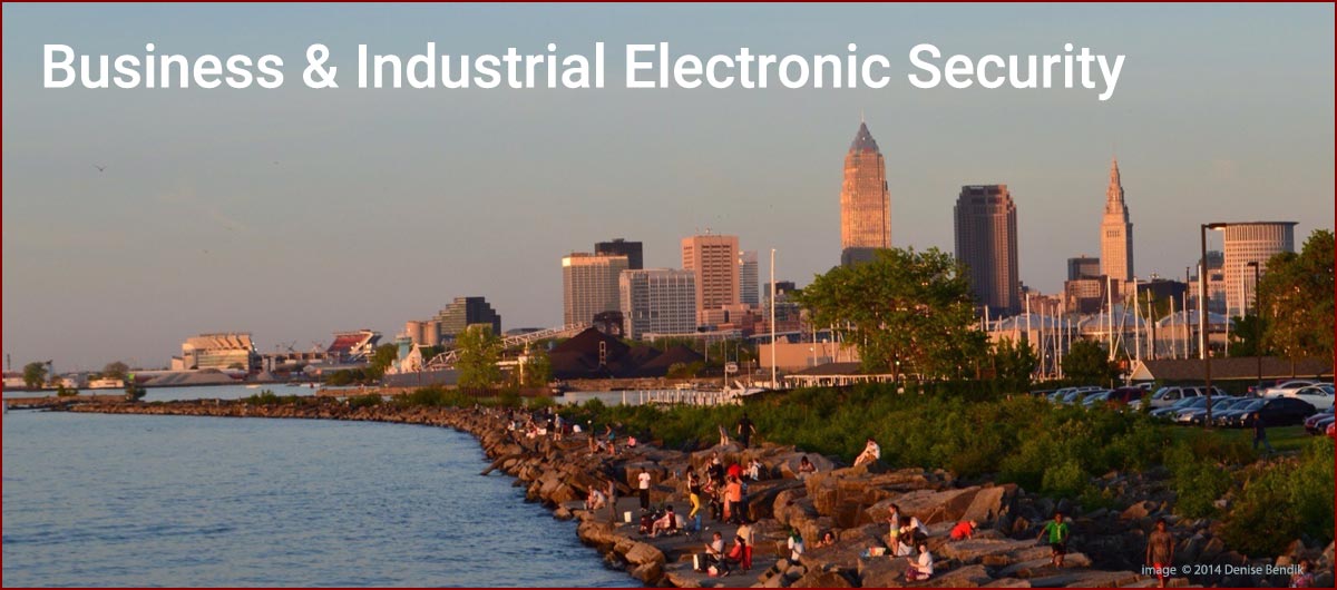 View of Lake Erie coastline with downtown Cleveland cityscape, with words: Business & Industrial Electronic Security